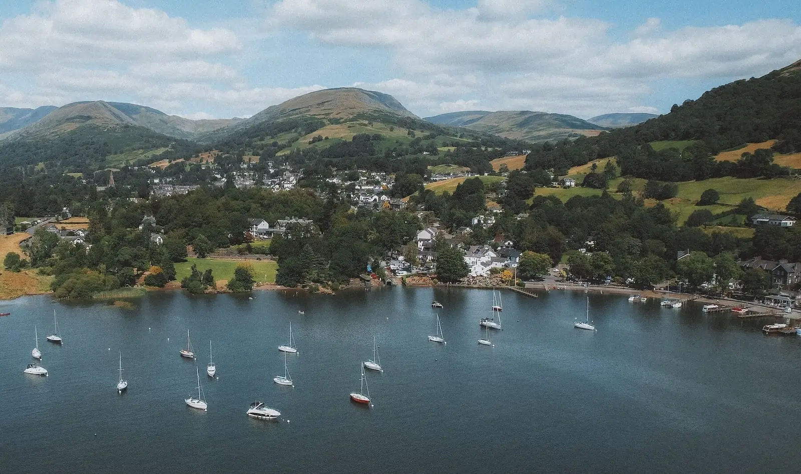 Moored yachts at Waterhead on Windermere, with Ambleside and the fells behind